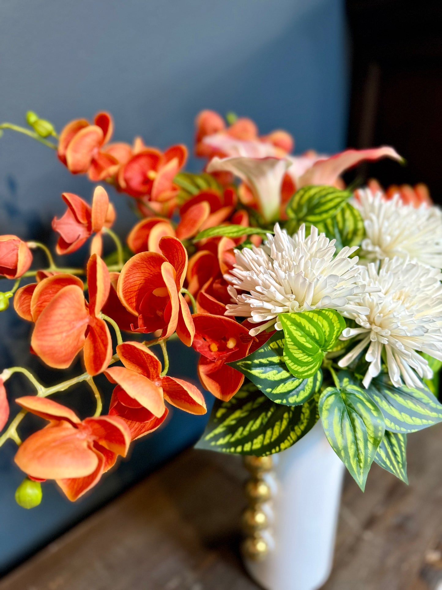 Bright Orange Real Touch Orchids With White Chrysanthemums in a Gold and White Vase
